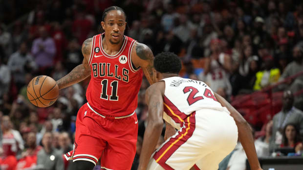 Oct 19, 2022; Miami, Florida, USA; Chicago Bulls forward DeMar DeRozan (11) brings the ball up the court as Miami Heat forward Haywood Highsmith (24) defends in the first half at FTX Arena.