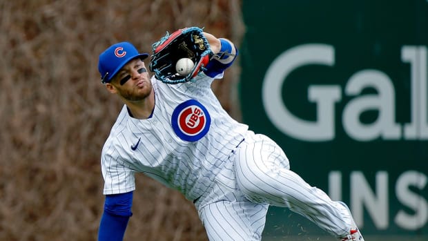 Apr 23, 2022; Chicago, Illinois, USA; Chicago Cubs left fielder Ian Happ (8) makes a catch for an out on a fly ball hit by Pittsburgh Pirates third baseman Michael Chavis (not pictured) during the first inning at Wrigley Field.