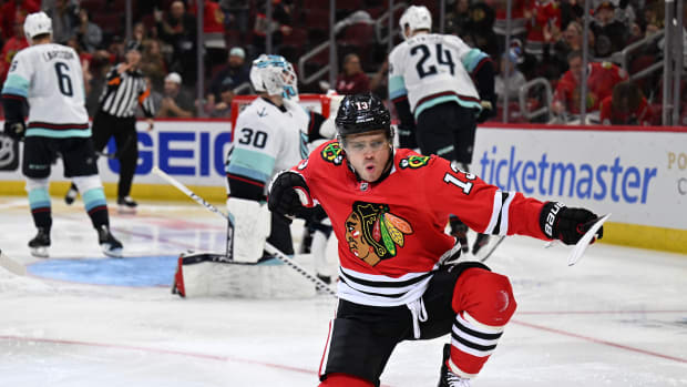 Oct 23, 2022; Chicago, Illinois, USA; Chicago Blackhawks forward Max Domi (13) celebrates his power play goal in the second period against the Seattle Kraken at United Center.