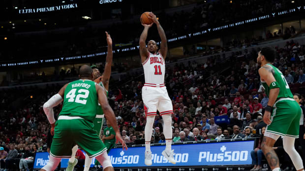 Oct 24, 2022; Chicago, Illinois, USA; Chicago Bulls forward DeMar DeRozan (11) shoots a three point basket against the Boston Celtics during the first half at United Center.
