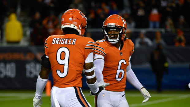 Oct 13, 2022; Chicago, Illinois, USA; Chicago Bears safety Jaquan Brisker (9) and Chicago Bears cornerback Kyler Gordon (6) after Brisker sacked Washington Commanders quarterback Carson Wentz (11) during the first half at Soldier Field.
