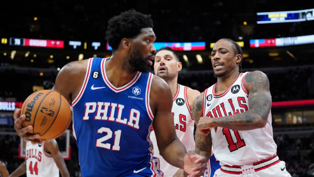 Oct 29, 2022; Chicago, Illinois, USA; Philadelphia 76ers center Joel Embiid (21) is defended by Chicago Bulls forward DeMar DeRozan (11) during the second half at United Center.