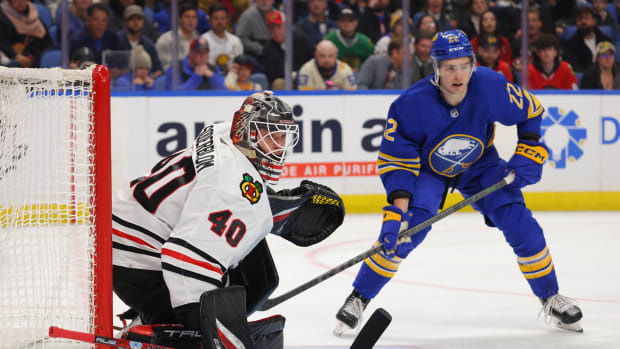 Oct 29, 2022; Buffalo, New York, USA; Chicago Blackhawks goaltender Arvid Soderblom (40) and Buffalo Sabres right wing Jack Quinn (22) look for the puck during the second period at KeyBank Center.