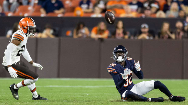 Aug 27, 2022; Cleveland, Ohio, USA; Chicago Bears wide receiver Isaiah Coulter (82) catches the ball while sitting on the ground against Cleveland Browns cornerback Herb Miller (29) during the fourth quarter at FirstEnergy Stadium.