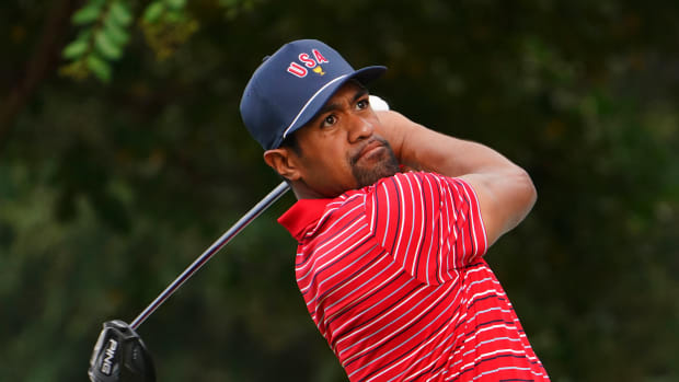 Sep 25, 2022; Charlotte, North Carolina, USA; Team USA golfer Tony Finau hits his tee shot on the 17th hole during the singles match play of the Presidents Cup golf tournament at Quail Hollow Club.