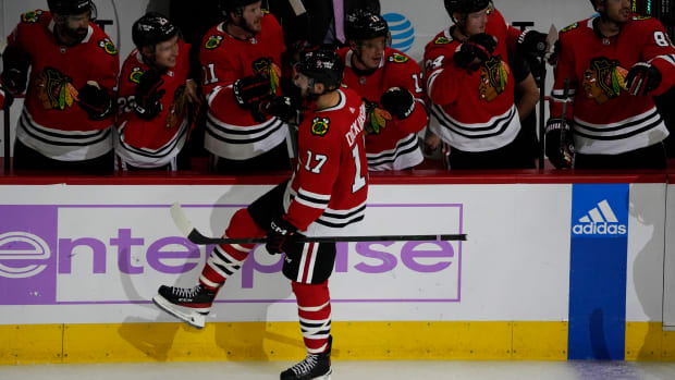 Nov 3, 2022; Chicago, Illinois, USA; Chicago Blackhawks center Jason Dickinson (17) celebrates his goal against the Los Angeles Kings during the second period at United Center.