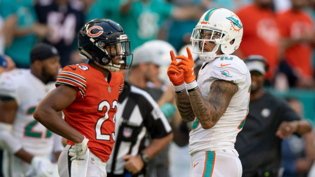 Oct 14, 2018; Miami Gardens, FL, USA; Miami Dolphins wide receiver Kenny Stills (10) reacts to a reception during overtime in front of Chicago Bears corner back Kyle Fuller (23) at Hard Rock Stadium.