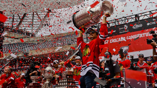 Jun 18, 2015; Chicago, IL, USA; Chicago Blackhawks defenseman Niklas Hjalmarsson (4) holds the Stanley Cup during the 2015 Stanley Cup championship rally at Soldier Field.