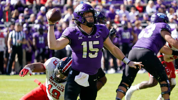 Nov 5, 2022; Fort Worth, Texas, USA; TCU Horned Frogs quarterback Max Duggan (15) avoids the pressure of Texas Tech Red Raiders linebacker Tyree Wilson (19) during the second half of a game at Amon G. Carter Stadium.