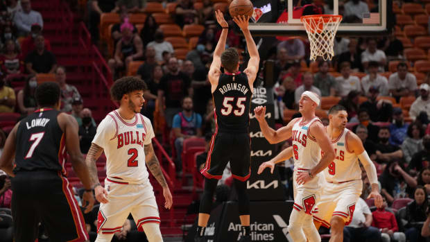 Dec 11, 2021; Miami, Florida, USA; Miami Heat forward Duncan Robinson (55) attempts a three point shot against the Chicago Bulls during the first half at FTX Arena.