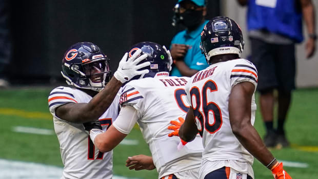 Sep 27, 2020; Atlanta, Georgia, USA; Chicago Bears wide receiver Anthony Miller (17) quarterback Nick Foles (9) and tight end Demetrius Harris (86) react on the field after the Bears scored the go ahead touchdown against the Atlanta Falcons during the fourth quarter at Mercedes-Benz Stadium.