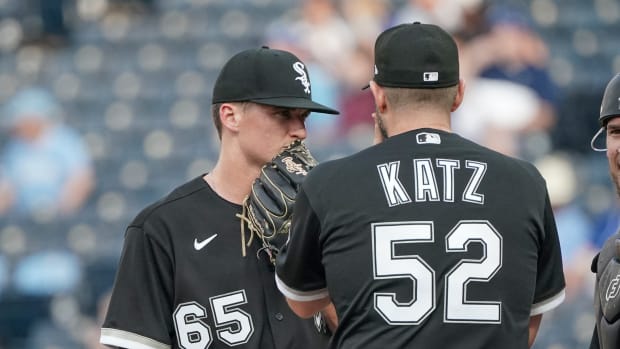 May 17, 2022; Kansas City, Missouri, USA; Chicago White Sox pitching coach Ethan Katz (52) talks with starting pitcher Davis Martin (65) at the mound against the Kansas City Royals in the second inning at Kauffman Stadium.