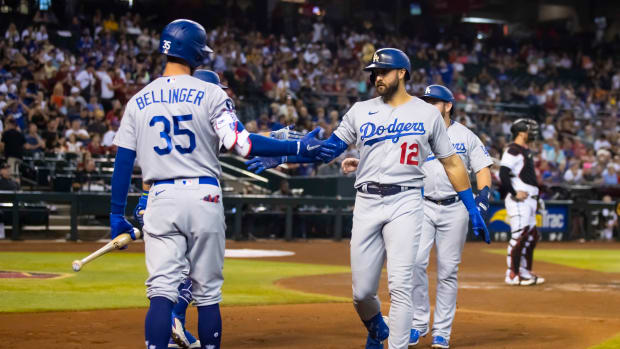 Sep 13, 2022; Phoenix, Arizona, USA; Los Angeles Dodgers outfielder Joey Gallo (12) celebrates with teammate Cody Bellinger after hitting a two run home run in the second inning against the Arizona Diamondbacks at Chase Field.