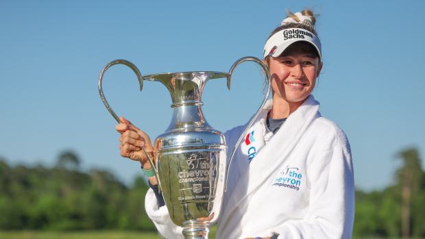 Apr 21, 2024; The Woodlands, Texas, USA; Nelly Korda (USA) poses with the trophy after winning The Chevron Championship golf tournament.