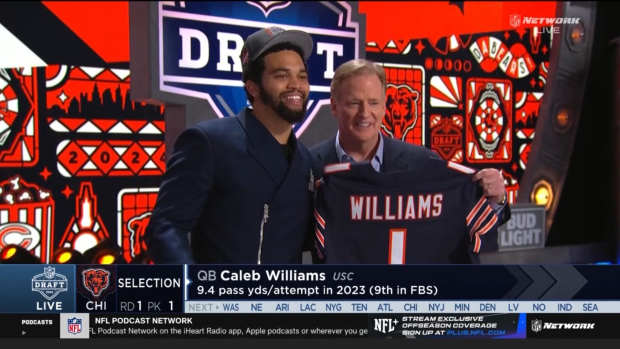 Quarterback Caleb Williams poses for a picture on stage with NFL commissioner Roger Goodell after being selected first overall by the Chicago Bears in the 2024 NFL Draft.