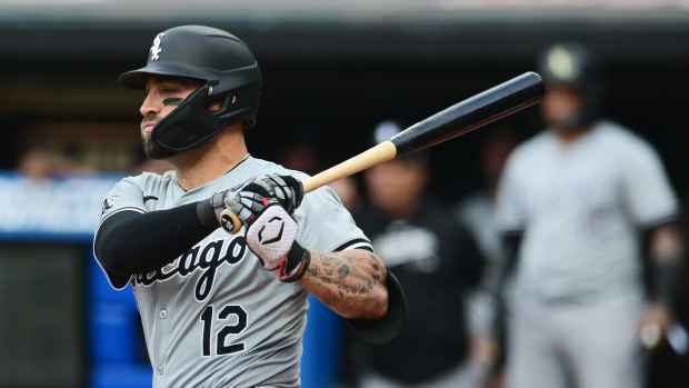 Apr 9, 2024; Cleveland, Ohio, USA; Chicago White Sox center fielder Kevin Pillar (12) hits an RBI double during the first inning against the Cleveland Guardians at Progressive Field.