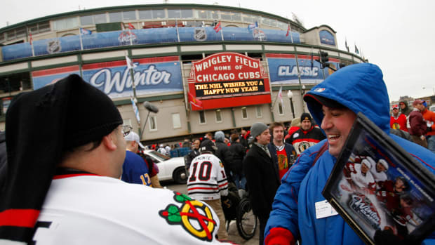 Jan 1, 2009; Chicago, IL, USA; A man sells commemorative plaques to fans before the Winter Classic between the Chicago Blackhawks and Detroit Red Wings at Wrigley Field.