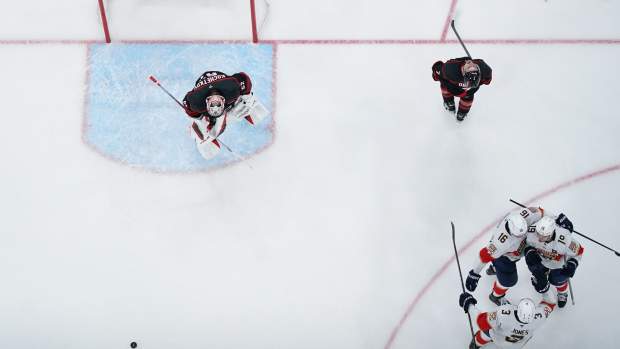 May 22, 2025; Raleigh, North Carolina, USA; Florida Panthers forward Aleksander Barkov (16) celebrates scoring with defenseman Seth Jones (3) and forward Matthew Tkachuk (19) against Carolina Hurricanes goaltender Pyotr Kochetkov (52) during the third period in game two of the Eastern Conference Final of the 2025 Stanley Cup Playoffs at Lenovo Center.