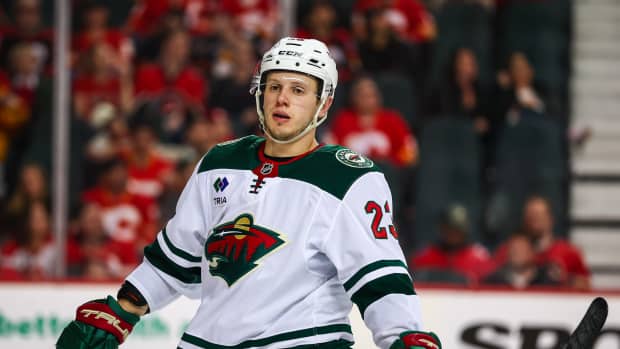 Apr 11, 2025; Calgary, Alberta, CAN; Minnesota Wild center Marco Rossi (23) against the Calgary Flames during the third period at Scotiabank Saddledome.