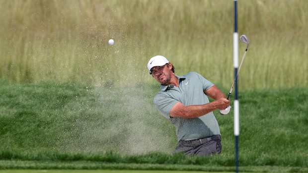 Jun 12, 2025; Oakmont, Pennsylvania, USA; Brooks Koepka plays a shot from a bunker on the eighth hole during the first round of the U.S. Open golf tournament.