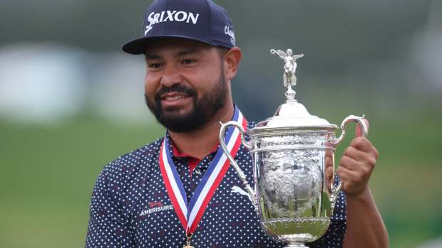Jun 15, 2025; Oakmont, Pennsylvania, USA; JJ Spaun celebrates with the championship trophy after winning the 125th U.S. Open golf tournament.