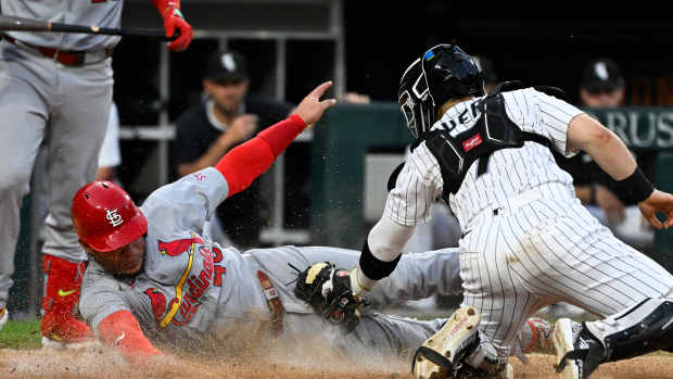 Jun 17, 2025; Chicago, Illinois, USA; St. Louis Cardinals first baseman Willson Contreras (40) steals home against Chicago White Sox catcher Edgar Quero (7) during the fifth inning at Rate Field.