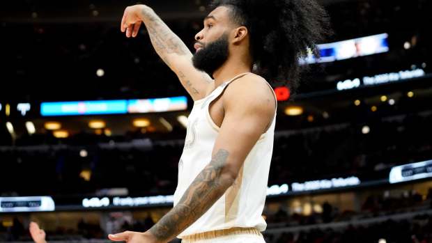 an 4, 2025; Chicago, Illinois, USA; Chicago Bulls guard Coby White (0) gestures after making a three point basket against the New York Knicks during the first quarter at United Center.