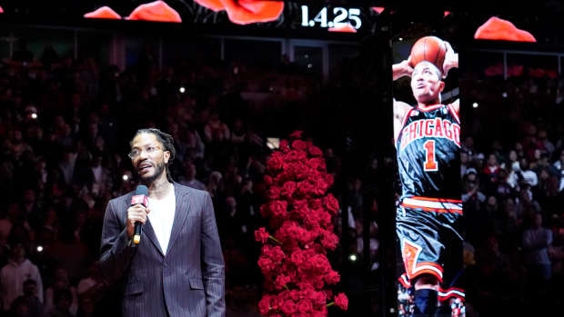 Jan 4, 2025; Chicago, Illinois, USA; Chicago Bulls and New York Knicks former player Derrick Rose speaks as he is honored at halftime of a game between the Chicago Bulls and the New York Knicks at United Center.