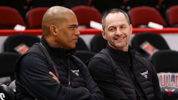 Apr 22, 2022; Chicago, Illinois, USA; Chicago Bulls executive vice president of basketball operations Arturas Karnisovas (right) talks with general manager Marc Eversley (left) before game three of the first round for the 2022 NBA playoffs against the Milwaukee Bucks at United Center.