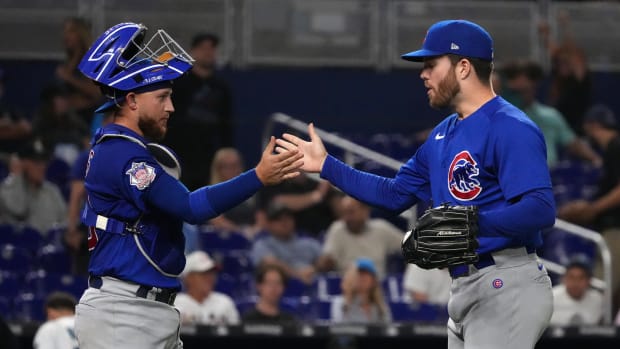 Sep 20, 2022; Miami, Florida, USA; Chicago Cubs catcher P.J. Higgins (48) celebrates with relief pitcher Brandon Hughes (47) after defeating the against the Miami Marlins at loanDepot park.