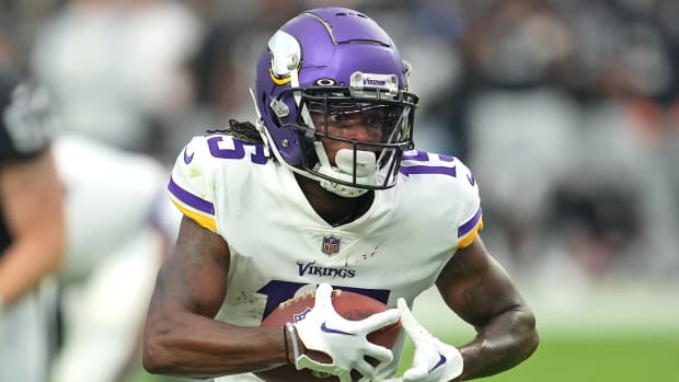 Wide receiver Ihmir Smith-Marsette carries the ball upfield for the Minnesota Vikings