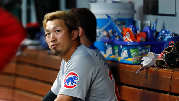Seiya Suzuki of the Chicago Cubs walks back to the dugout after