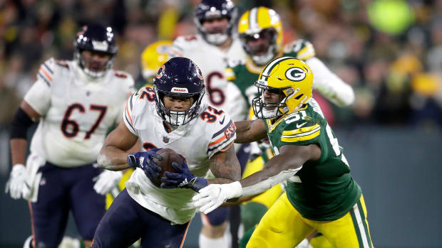 Green Bay Packers inside linebacker Krys Barnes (51) tackles Chicago Bears running back David Montgomery (32)during their football game on Sunday December 12, 2021, at Lambeau Field in Green Bay, Wis.