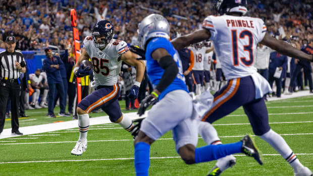 Jan 1, 2023; Detroit, Michigan, USA; Chicago Bears tight end Cole Kmet (85) runs with the ball for a touchdown against the Detroit Lions during the first quarter at Ford Field. Mandatory Credit: David Reginek-USA TODAY Sports