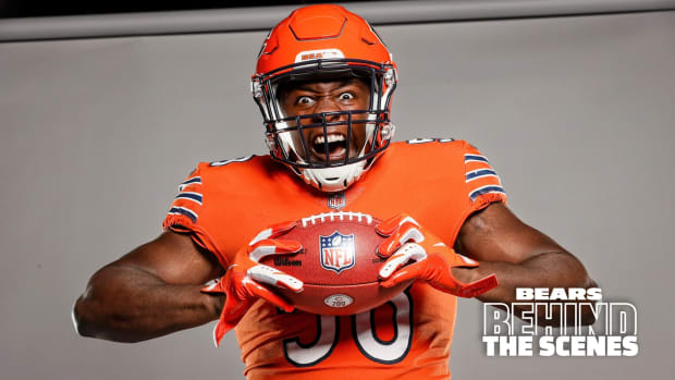 Chicago Bears linebacker Roquan Smith shows off the team's orange helmet and jersey combination