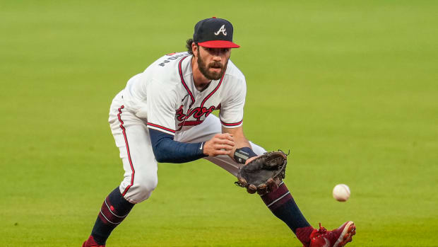Sep 20, 2022; Cumberland, Georgia, USA; Atlanta Braves shortstop Dansby Swanson (7) fields a ball hit by Washington Nationals first baseman Joey Meneses (45) during the first inning at Truist Park.