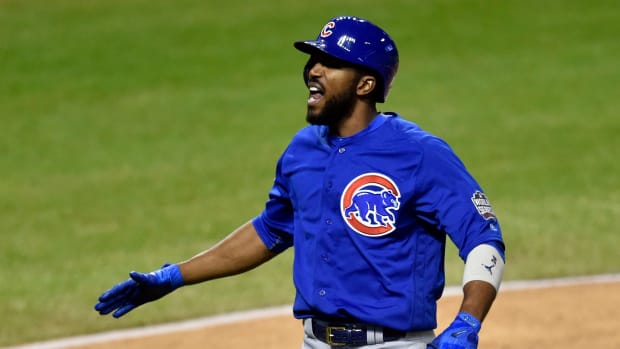 Nov 2, 2016; Cleveland, OH, USA; Chicago Cubs center fielder Dexter Fowler (24) celebrates after hitting a solo home run against the Cleveland Indians in the first inning in game seven of the 2016 World Series at Progressive Field.