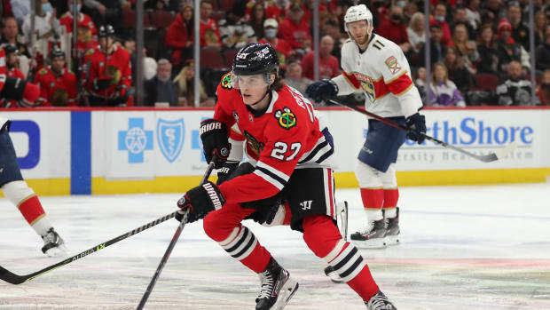 Feb 20, 2022; Chicago, Illinois, USA; Chicago Blackhawks left wing Lukas Reichel (27) skates with the puck during the first period against the Florida Panthers at the United Center.