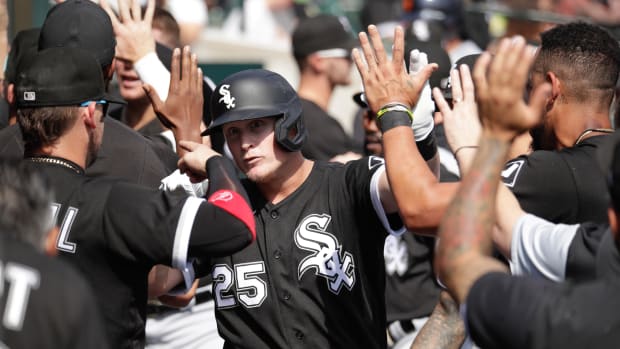 Sep 18, 2022; Detroit, Michigan, USA; Chicago White Sox first baseman Andrew Vaughn (25) high-fives teammates after hitting a grand slam in the fifth inning of the game against the Detroit Tigers at Comerica Park.