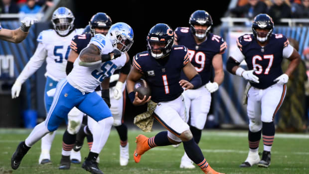 Nov 13, 2022; Chicago, Illinois, USA; Chicago Bears quarterback Justin Fields (1) runs for a touchdown against the Detroit Lions during the second half at Soldier Field.