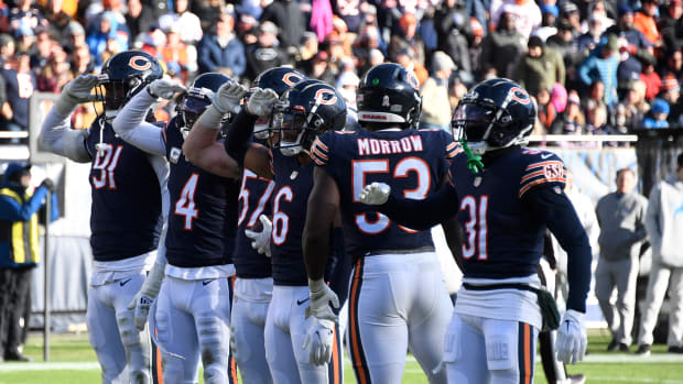 Nov 13, 2022; Chicago, Illinois, USA; Chicago Bears players salute after Chicago Bears linebacker Jack Sanborn (57) made an interception against the Detroit Lions during the second half at Soldier Field. The play was overturned due to a Bears penalty. Mandatory Credit: Matt Marton-USA TODAY Sports