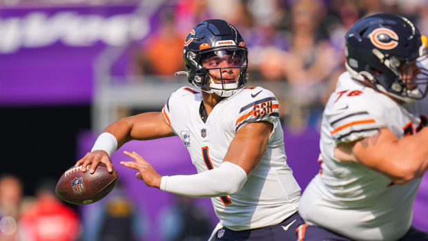 Oct 9, 2022; Minneapolis, Minnesota, USA; Chicago Bears quarterback Justin Fields (1) passes against the Minnesota Vikings in the first quarter at U.S. Bank Stadium.