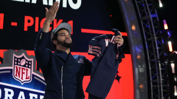 Apr 25, 2024; Detroit, MI, USA; Southern California Trojans quarterback Caleb Williams holds up his jersey after being selected by the Chicago Bears as the No. 1 pick in the first round of the 2024 NFL Draft at Campus Martius Park and Hart Plaza.