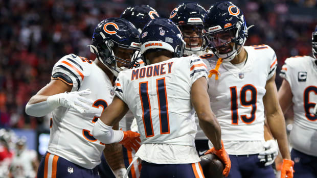 Nov 20, 2022; Atlanta, Georgia, USA; Chicago Bears wide receiver Darnell Mooney (11) celebrates with teammates after a touchdown catch against the Atlanta Falcons in the first quarter at Mercedes-Benz Stadium. Mandatory Credit: Brett Davis-USA TODAY Sports