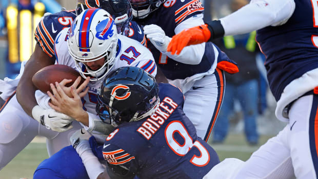 Dec 24, 2022; Chicago, Illinois, USA; Chicago Bears safety Jaquan Brisker (9) gets a sack on Buffalo Bills quarterback Josh Allen (17) during the second quarter at Soldier Field. Mandatory Credit: Mike Dinovo-USA TODAY Sports