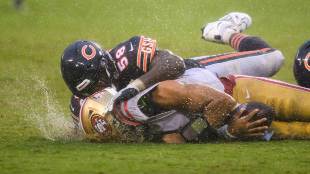 Sep 11, 2022; Chicago, Illinois, USA; San Francisco 49ers quarterback Trey Lance (5) is tackled after a run by Chicago Bears inside linebacker Roquan Smith (58) in the fourth quarter at Soldier Field.