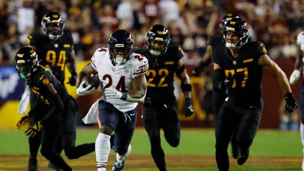 Chicago Bears running back Khalil Herbert (24) warms up prior to