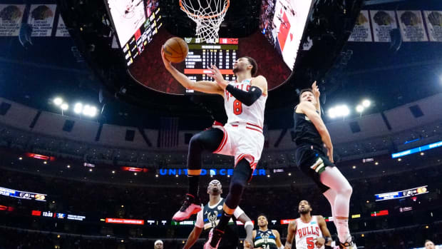 Apr 24, 2022; Chicago, Illinois, USA; Chicago Bulls guard Zach LaVine (8) goes to the basket as Milwaukee Bucks guard Grayson Allen (7) defends him in the first half during game four of the first round for the 2022 NBA playoffs at United Center. Mandatory Credit: David Banks-USA TODAY Sports