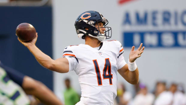 Aug 18, 2022; Seattle, Washington, USA; Chicago Bears quarterback Nathan Peterman (14) passes against the Seattle Seahawks during the fourth quarter at Lumen Field.