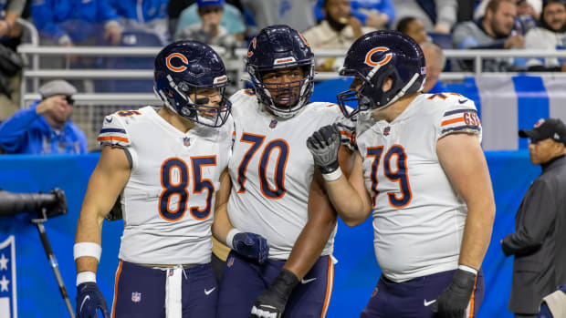 Jan 1, 2023; Detroit, Michigan, USA; Chicago Bears tight end Cole Kmet (85) celebrates his touchdown against the Detroit Lions with tackle Braxton Jones (70) and guard Michael Schofield III (79) during the first quarter at Ford Field. Mandatory Credit: David Reginek-USA TODAY Sports